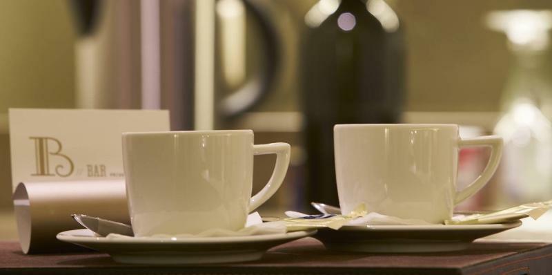 Portobay Flores Extérieur photo Two cups of coffee